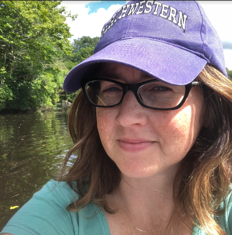 Child Reading a Book Outdoors in the Fall