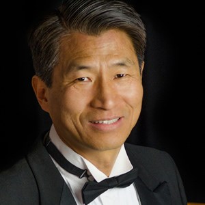 Child Reading a Book Outdoors in the Fall