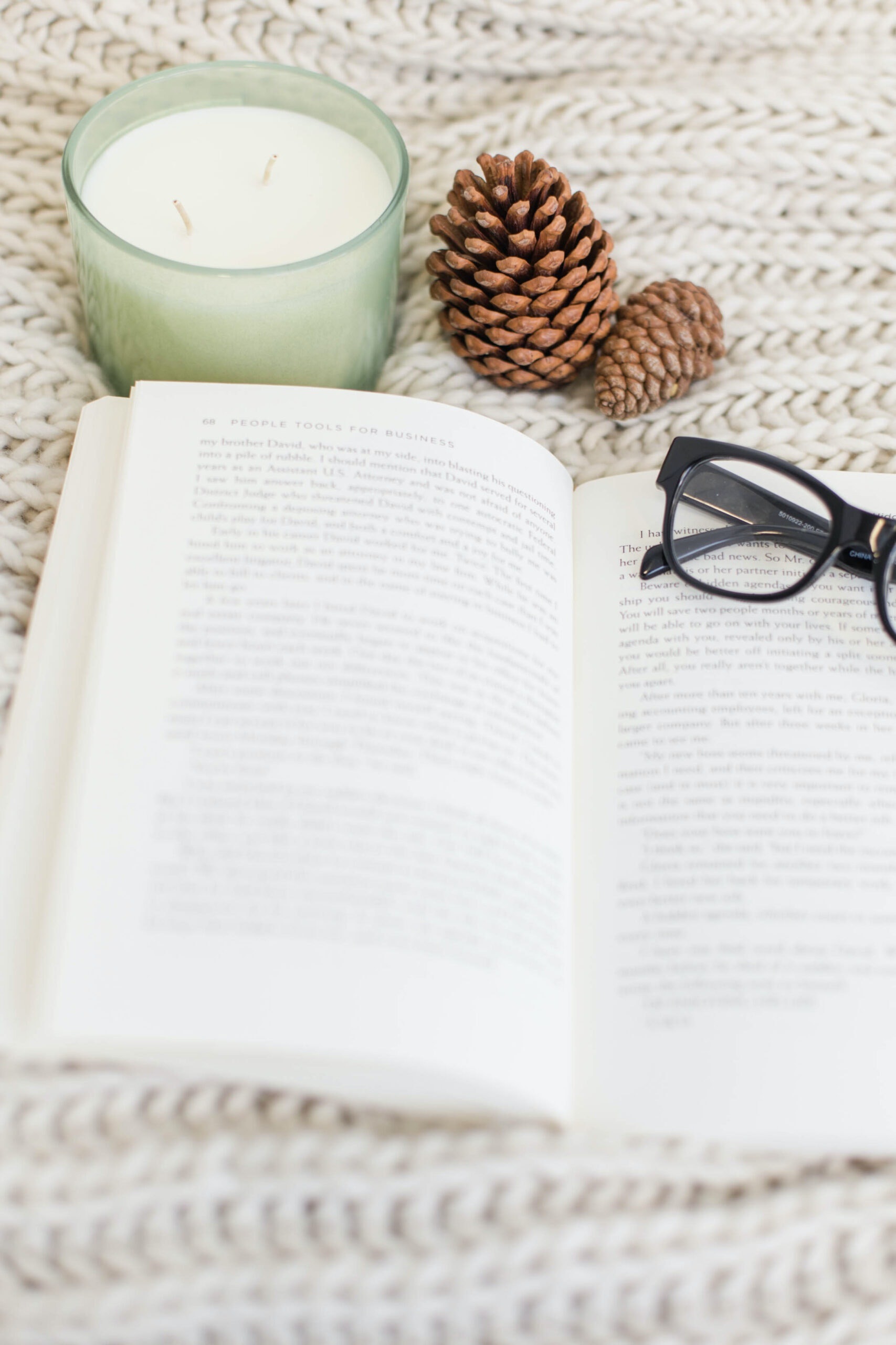 Black Framed Eyeglasses on White Book Page