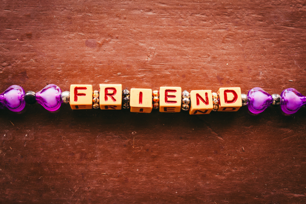Image: A friendship bracelet that reads "friend"