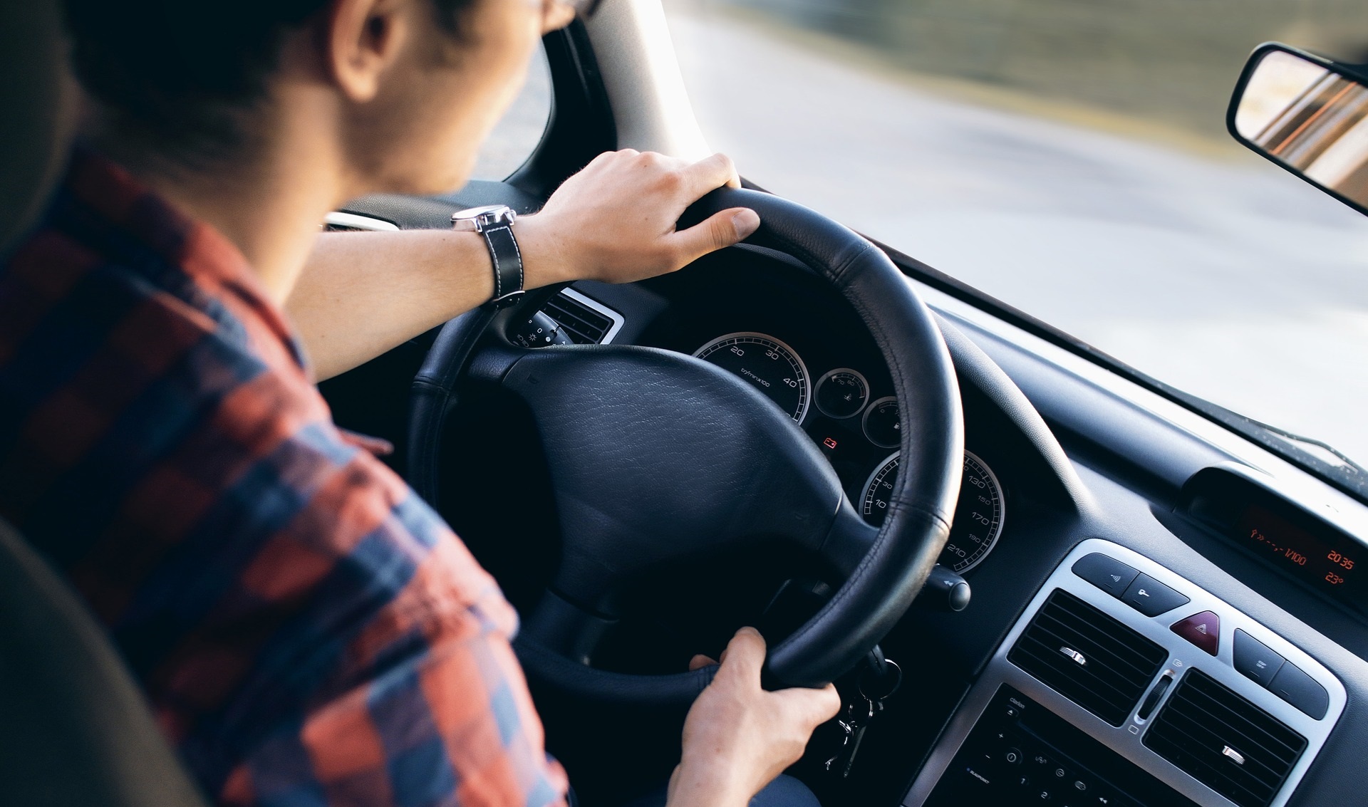 Interior View of Man Driving a Car