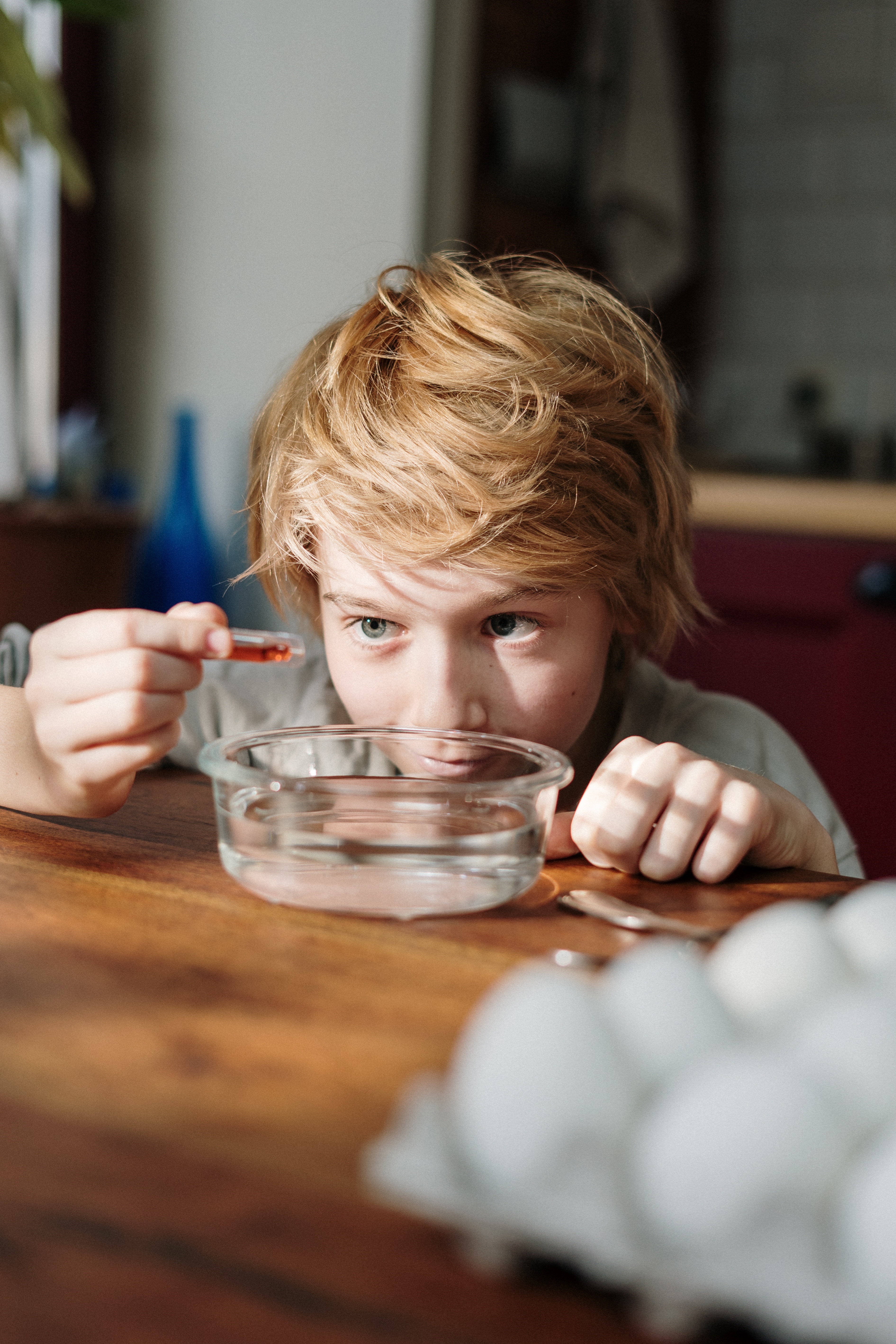 Kid Putting Dye into Water