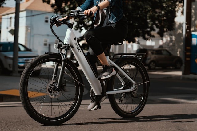 Photo of a person riding an e-bike.