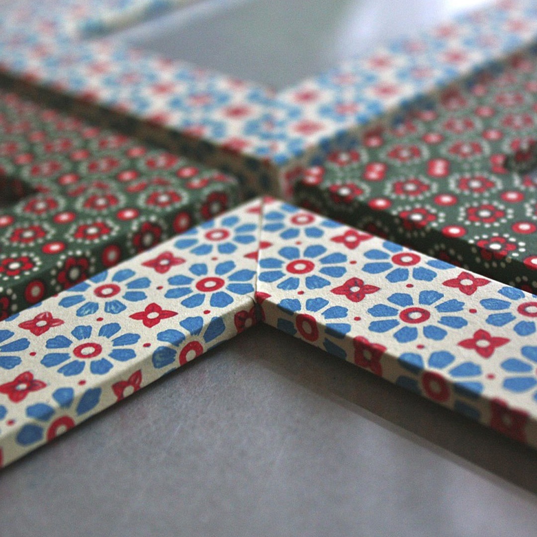 Four corners of picture frames painted in floral patterns