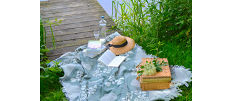 Books with Hat in the Park for a Picnic