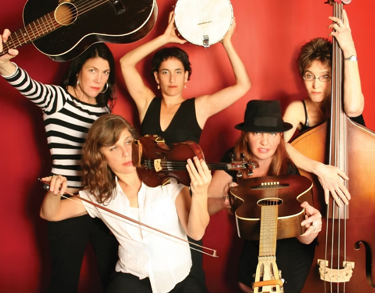 five musicians posing with guitars, fiddle, upright bass