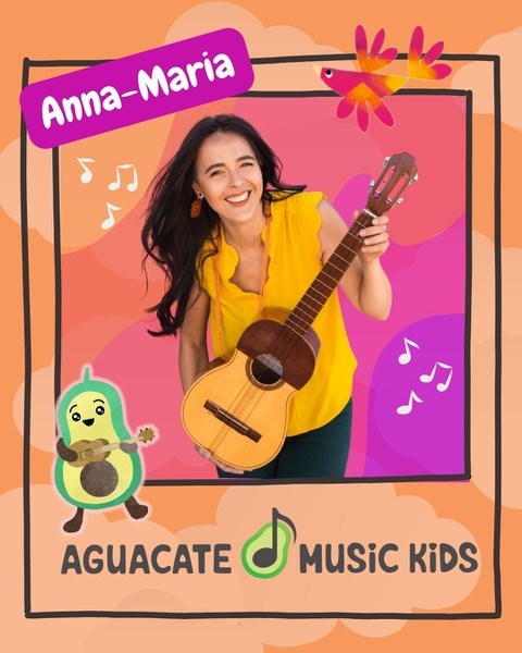 Portrait of Anna Maria from Aguacate Music Kids holding a guitar
