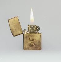 Cover of 'Prizefighter' with a lit gold lighter against grey background. 