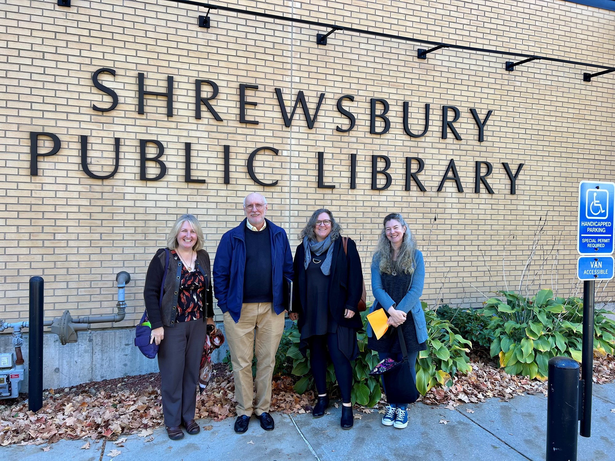 Russell Carrier with Lisa Downing, library director; Katy Wight, Vice President of the Forbes Library Board of Trustees; Molly Moss, assistant director