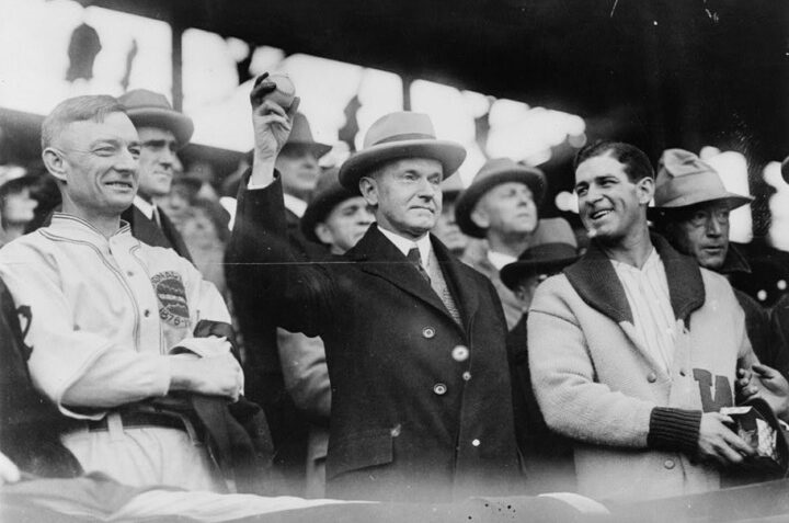 President Coolidge prepares to throw out the first ball of Game 3 of the 1925 World Series on Oct. 10. Pittsburgh Pirates manager Bill McKechnie stands to the president’s right and Washington Senators manager Bucky Harris stands on Coolidge’s left. Baseball commissioner Kennesaw Mountain Landis is visible at Harris’ left shoulder. (Library of Congress)