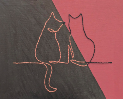 Holding a Mug of Cocoa in Front of Books