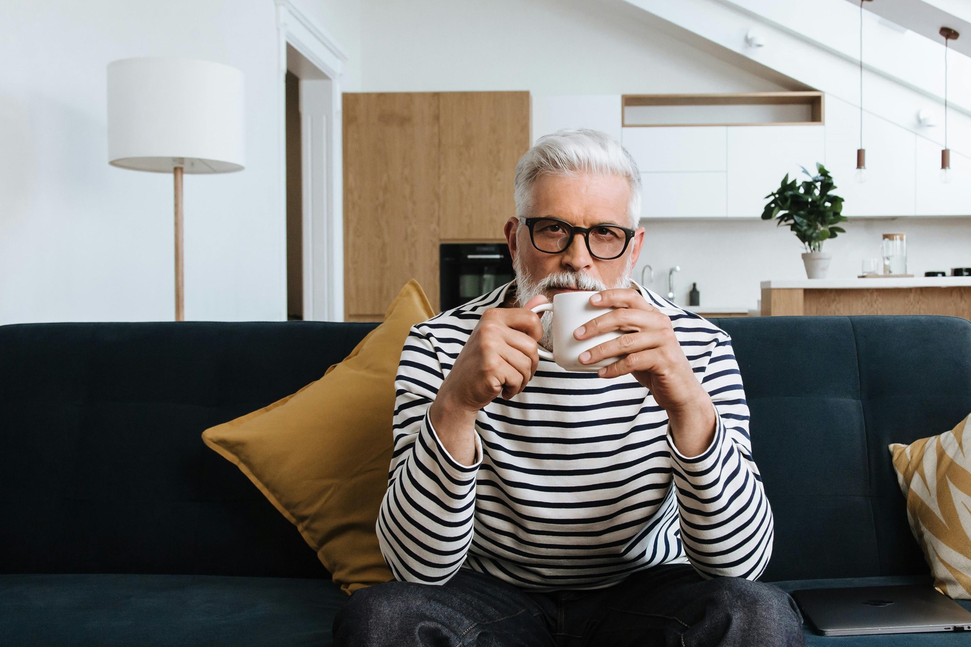 Holding a Mug of Cocoa in Front of Books