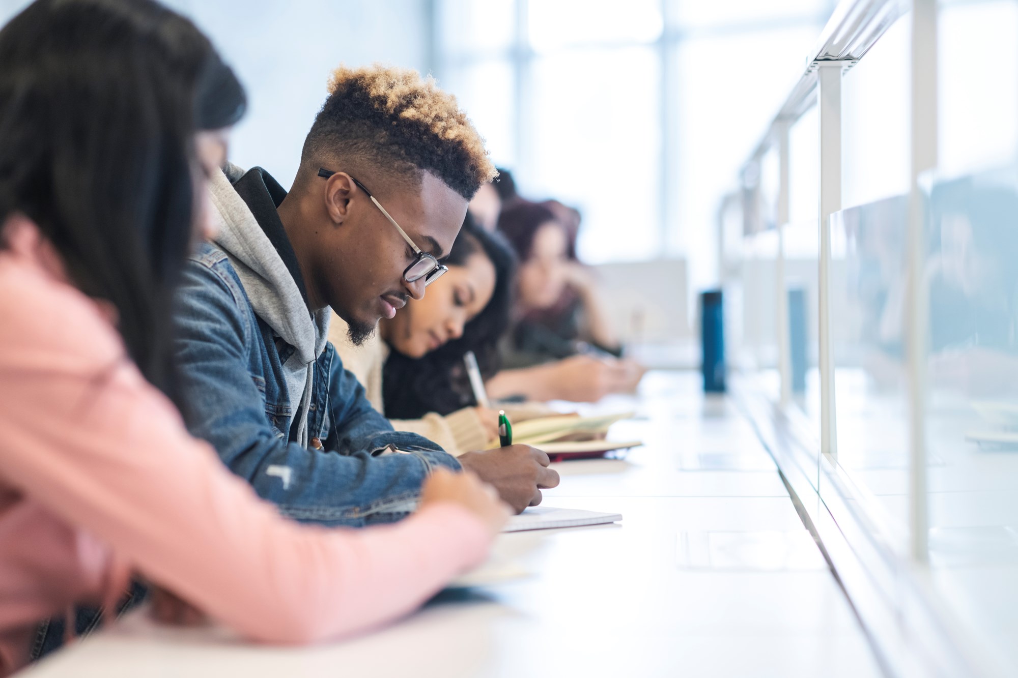 Group of Students Writing in Class