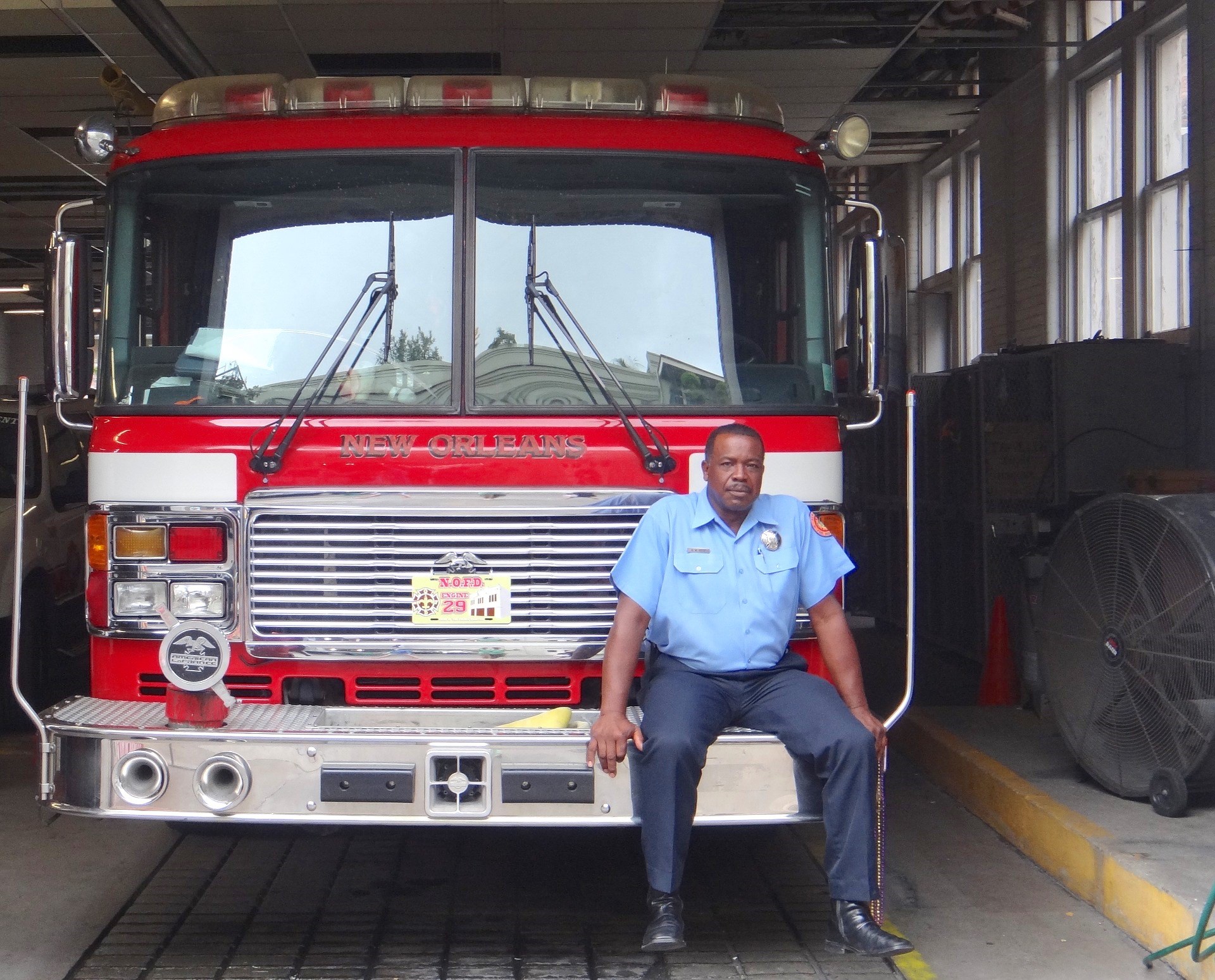 Holding a Mug of Cocoa in Front of Books