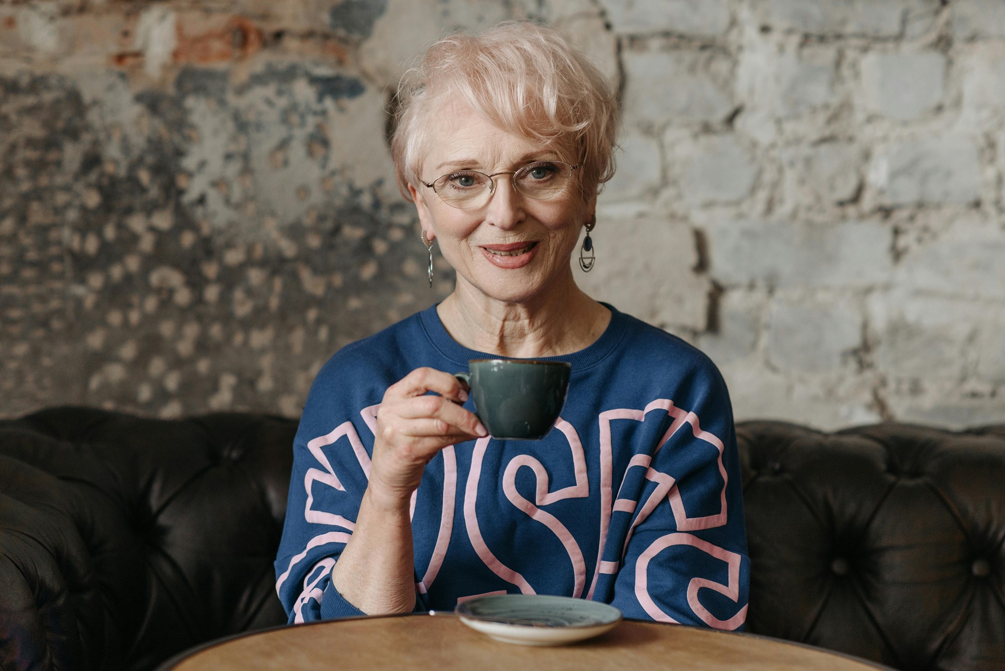 Holding a Mug of Cocoa in Front of Books
