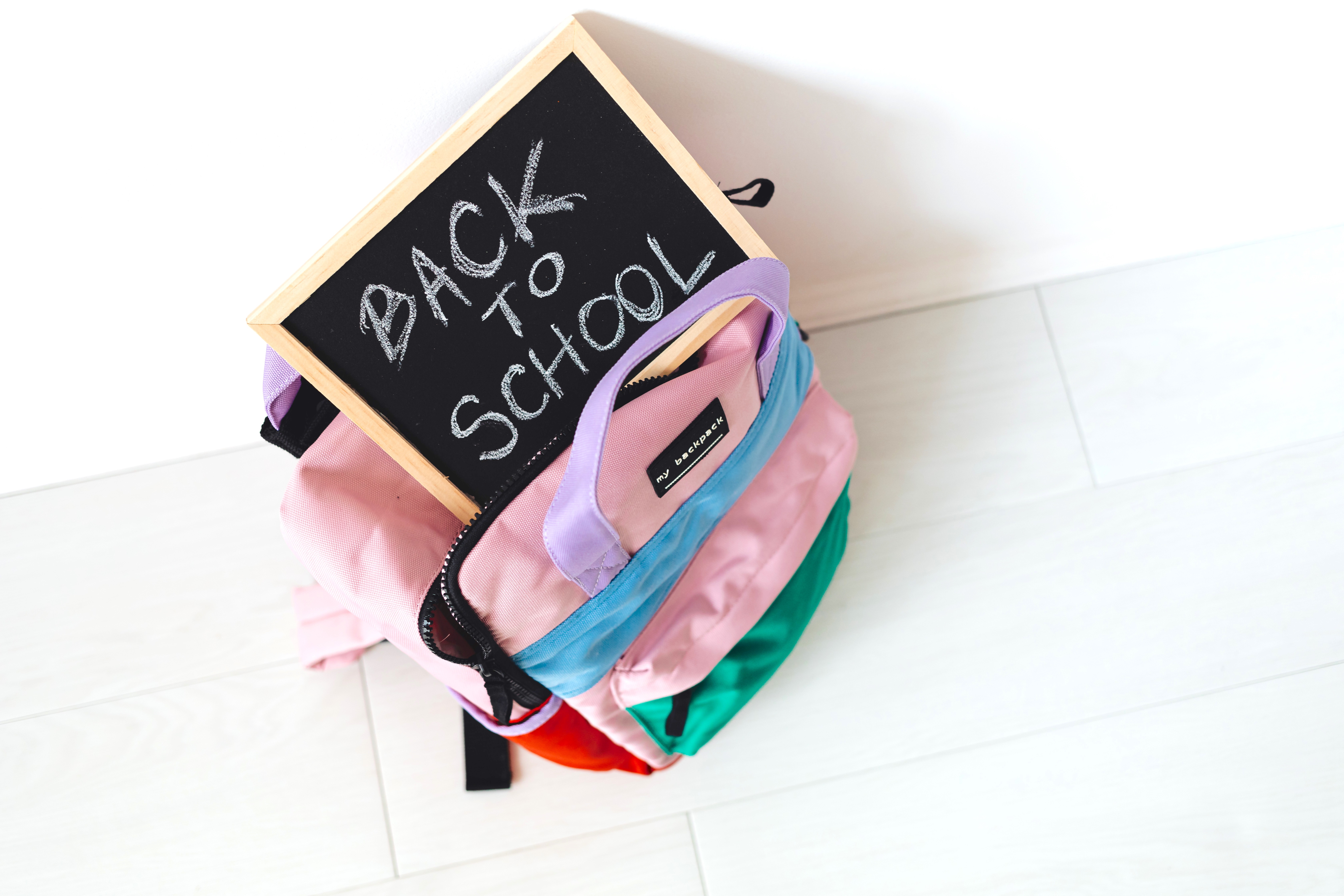 Back to School Written On Slate Board and a School Bag