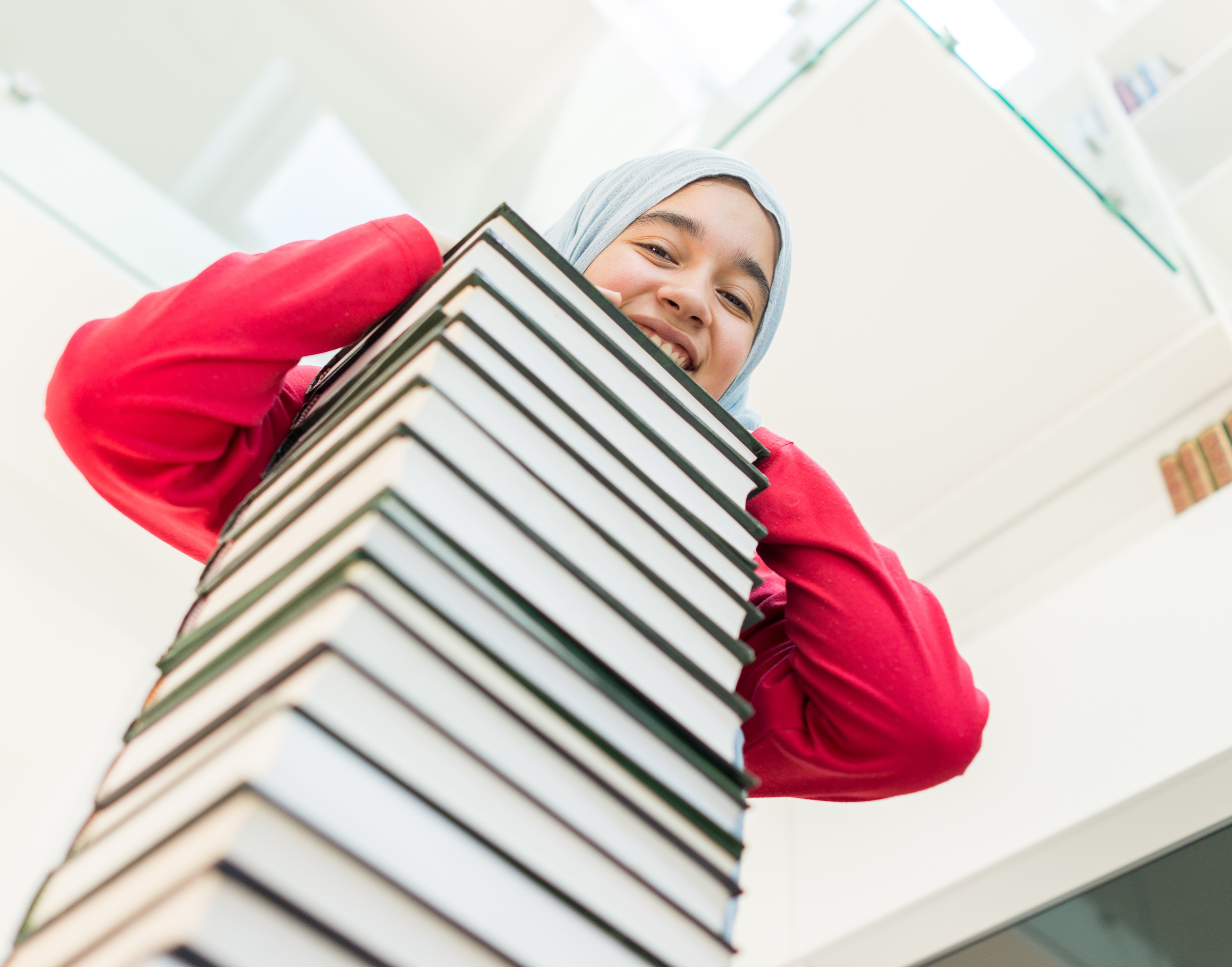 Teen Student with Stack of Books