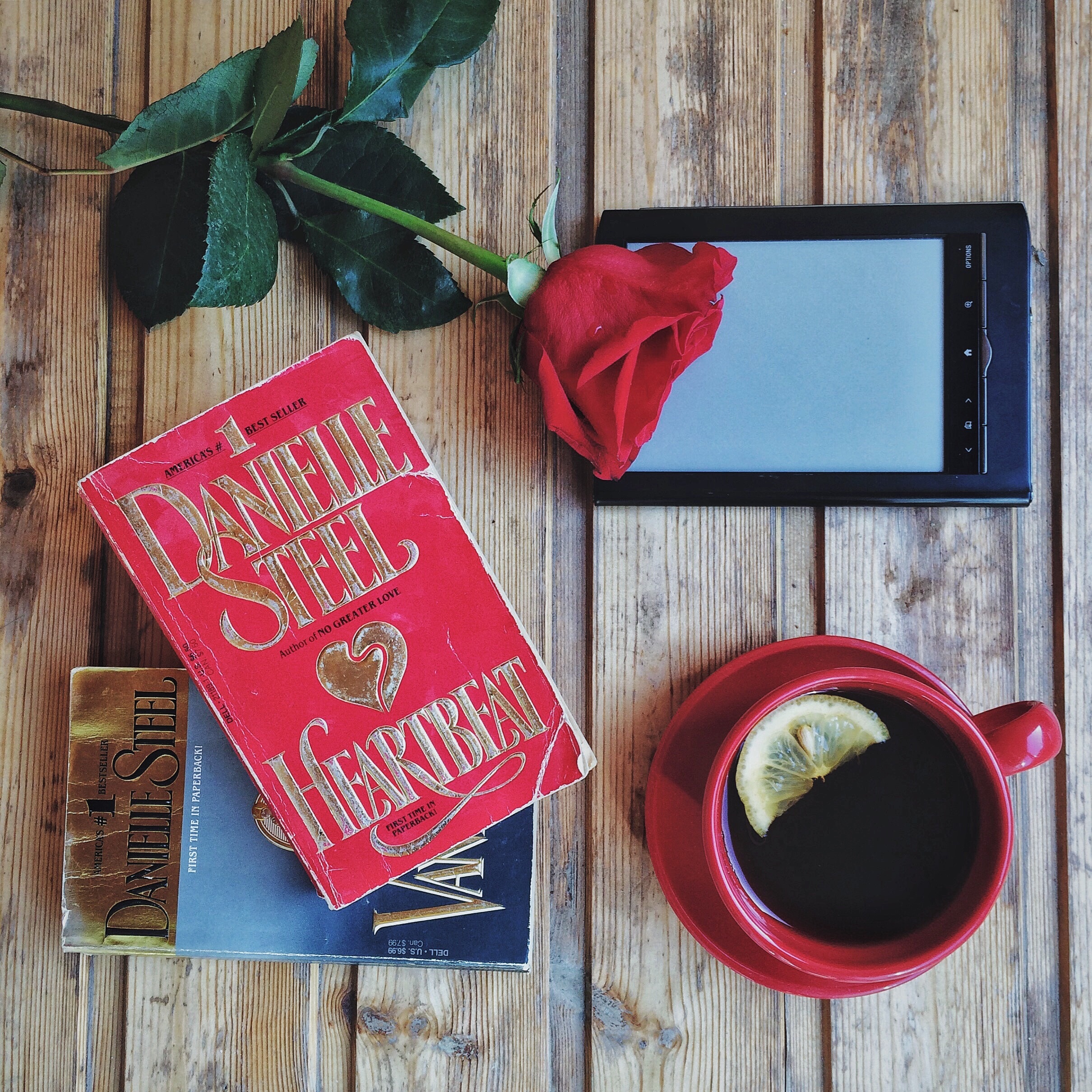 Books with Red Rose and Mug