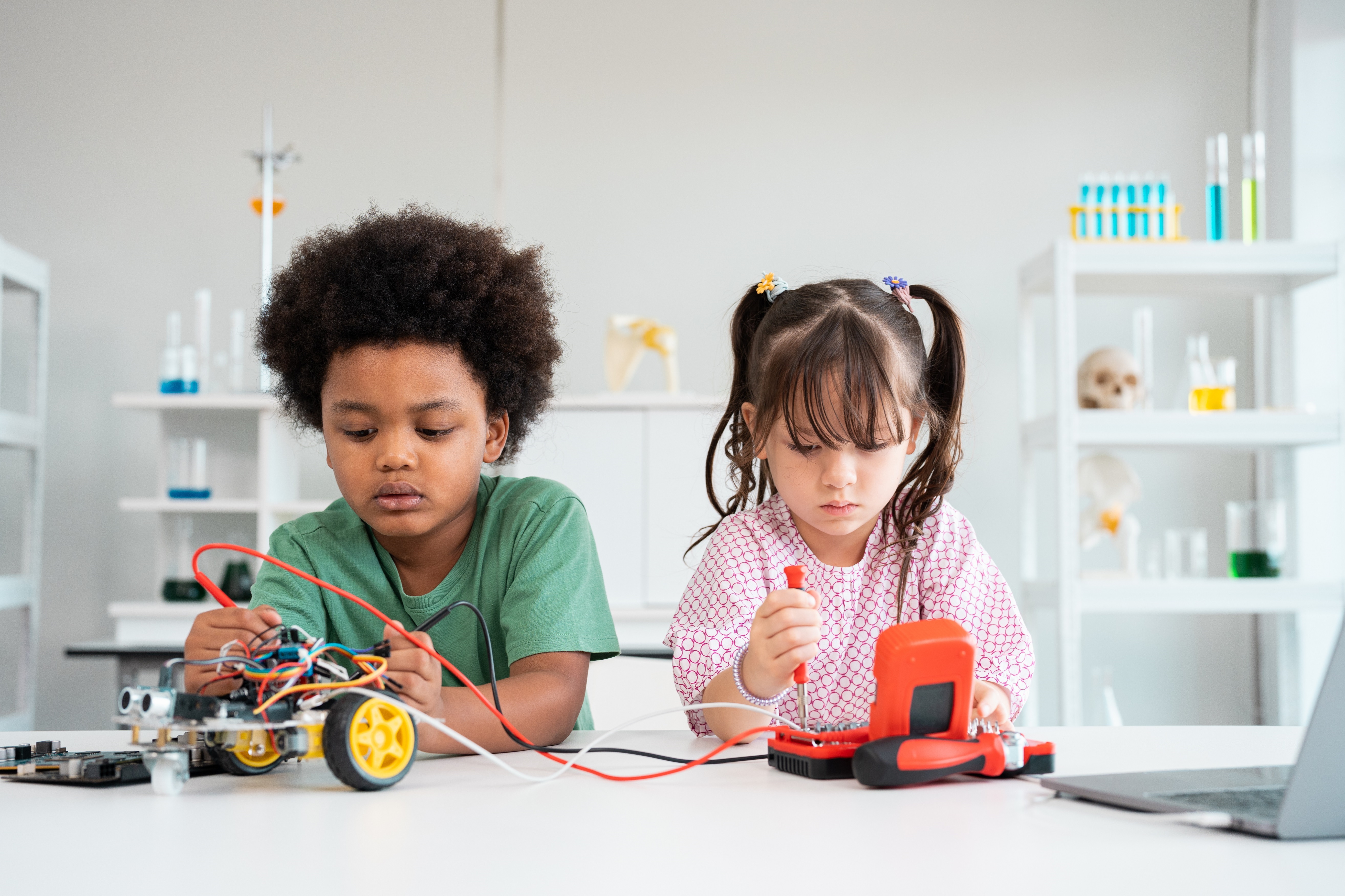 Kids Creating Robot Car At Lab In School