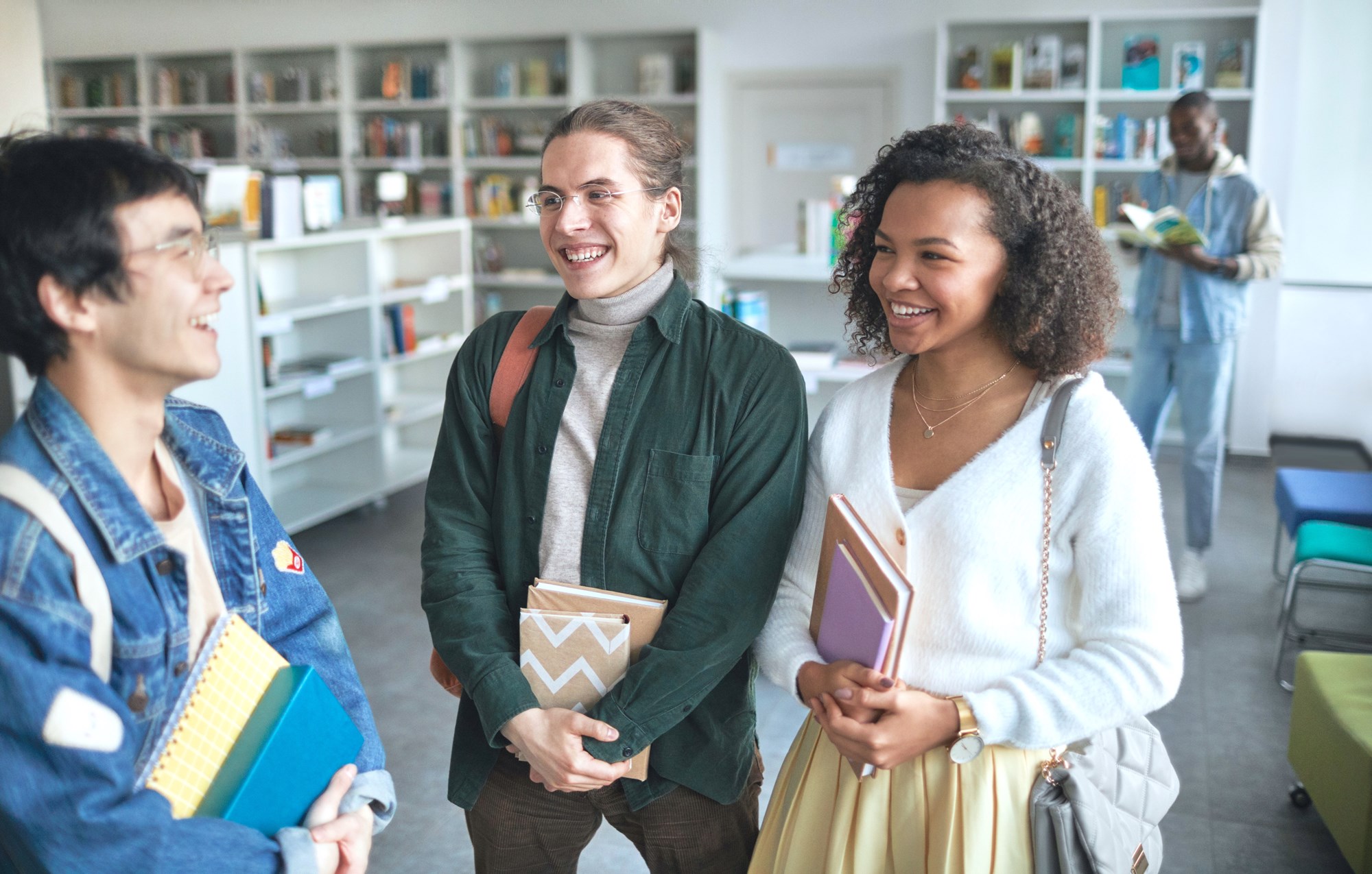 Group of Young Adults Standing Together in the Library
