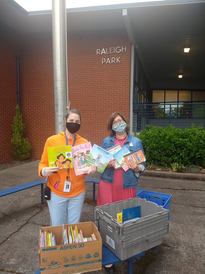 Librarian Terisa at elementary school with donated books