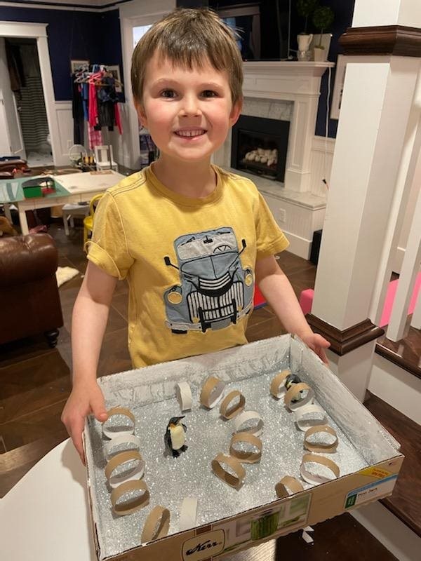 Young reader showcasing their reading log