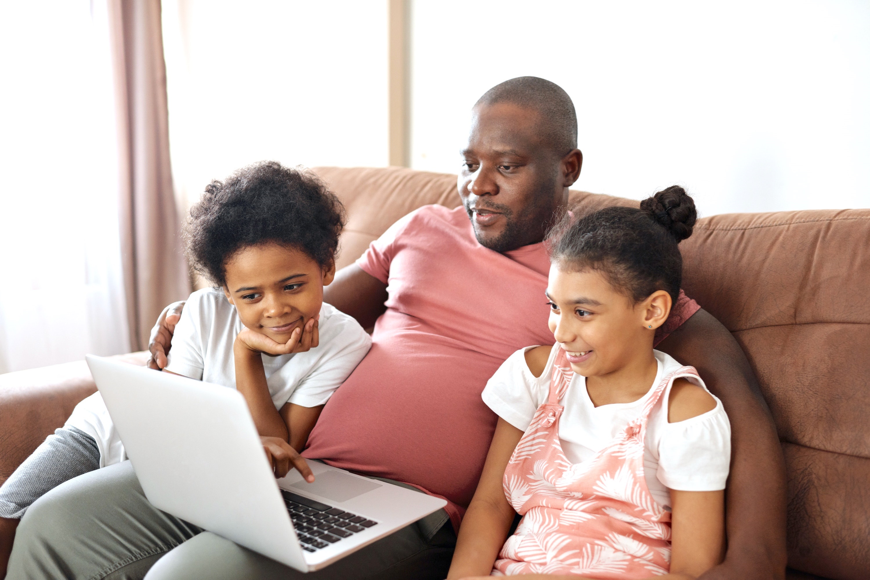 Family looking at a computer 
