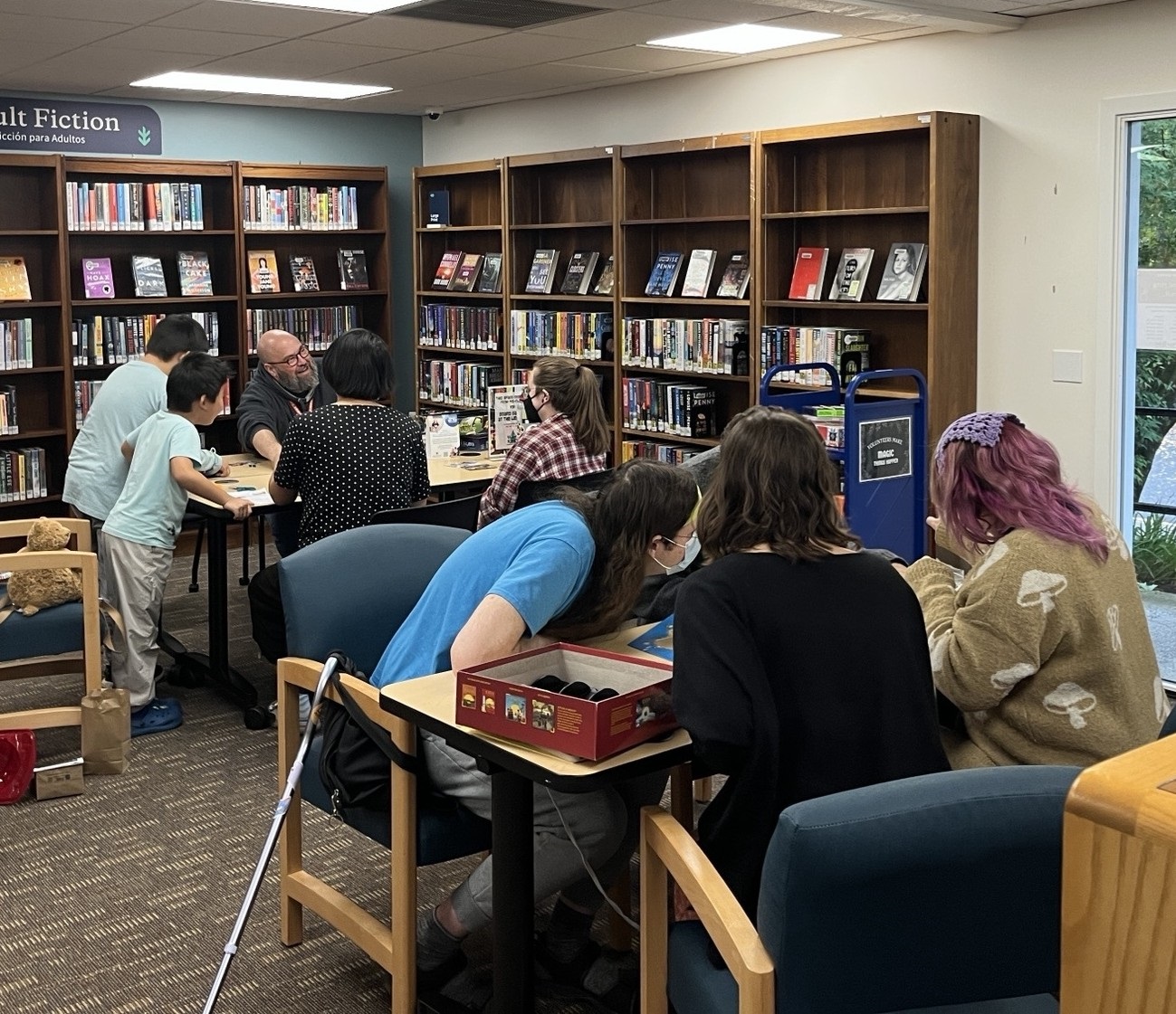 Photo of several small groups participating in Board Gaming at the Library