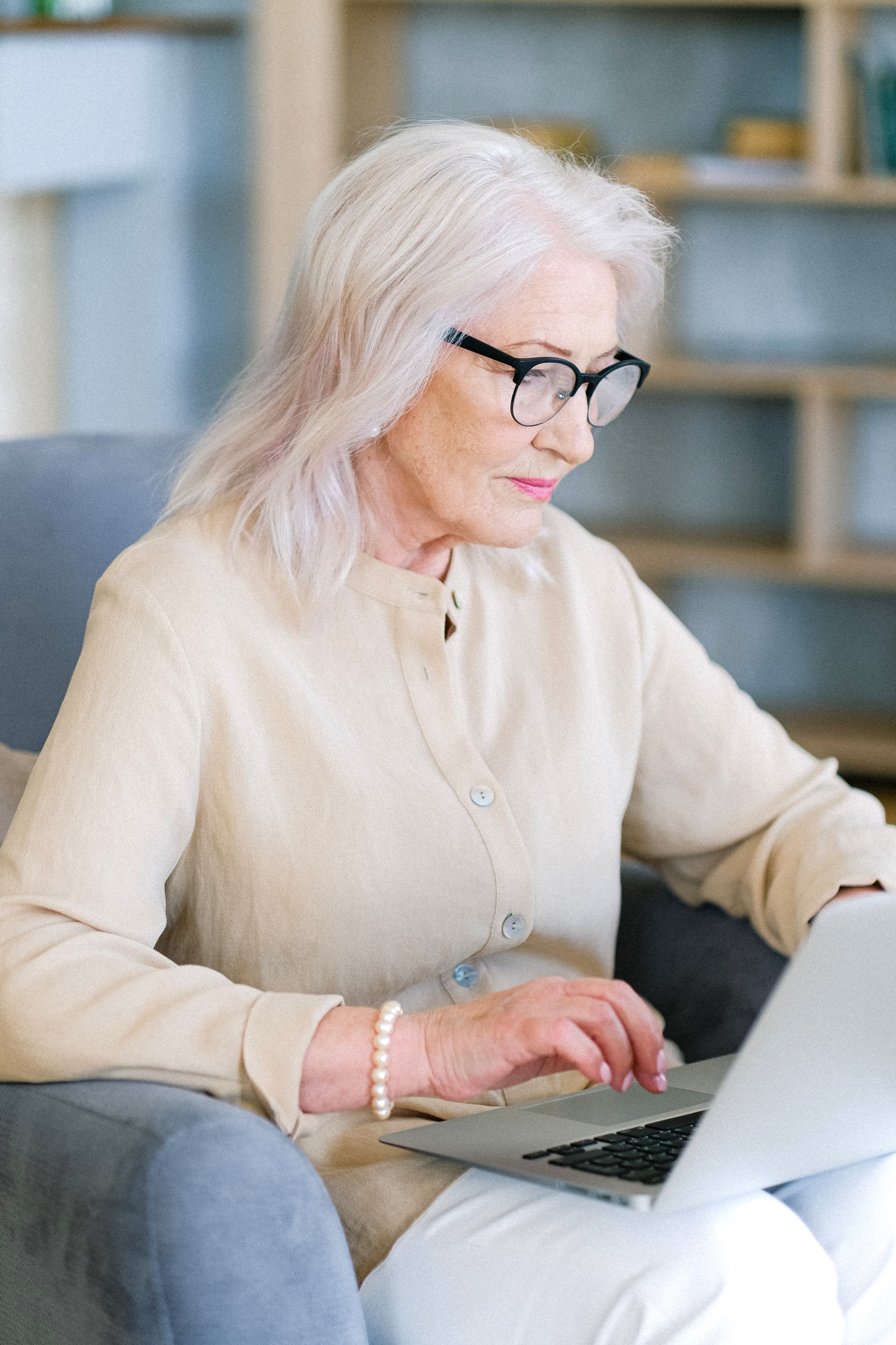 Woman in Using a Laptop in the Library