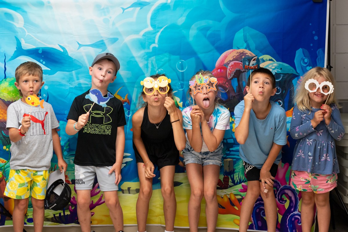 Mother and Young Daughter Walking Through the Library