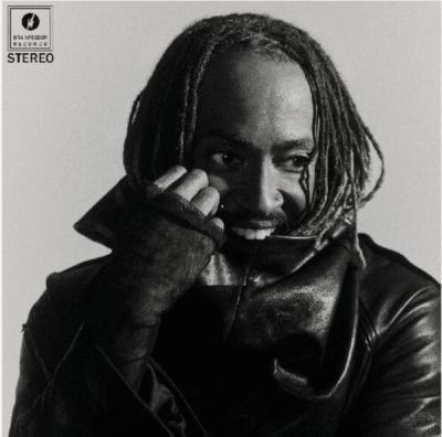 Album cover for Distracted by Thundercat, featuring a stylized, surreal portrait with bold colors and a dreamy, cosmic aesthetic. The artwork reflects the album’s blend of funk, R&amp;B, and futuristic themes.