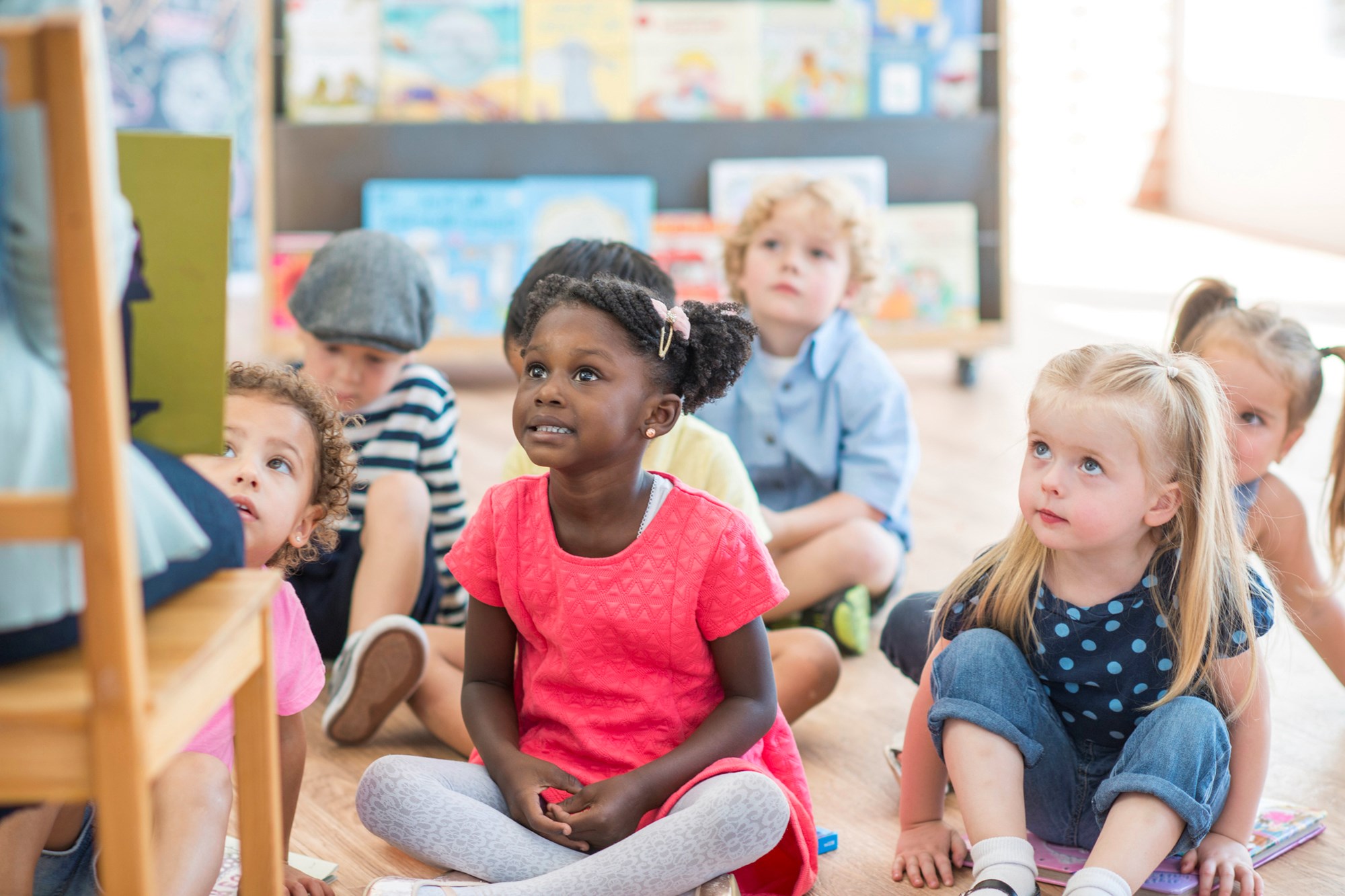librarian reading a book to children for storytime