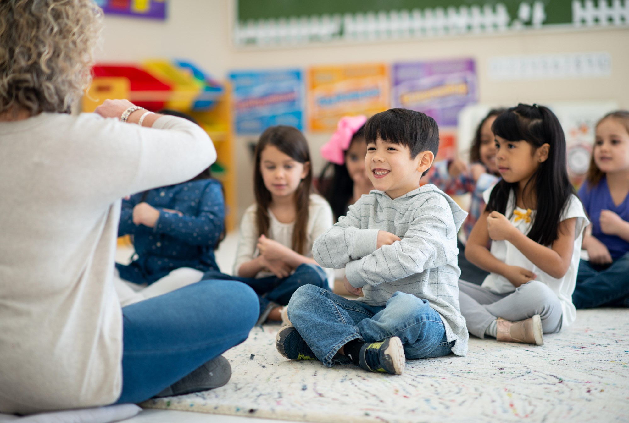 librarian reading a book to children for storytime