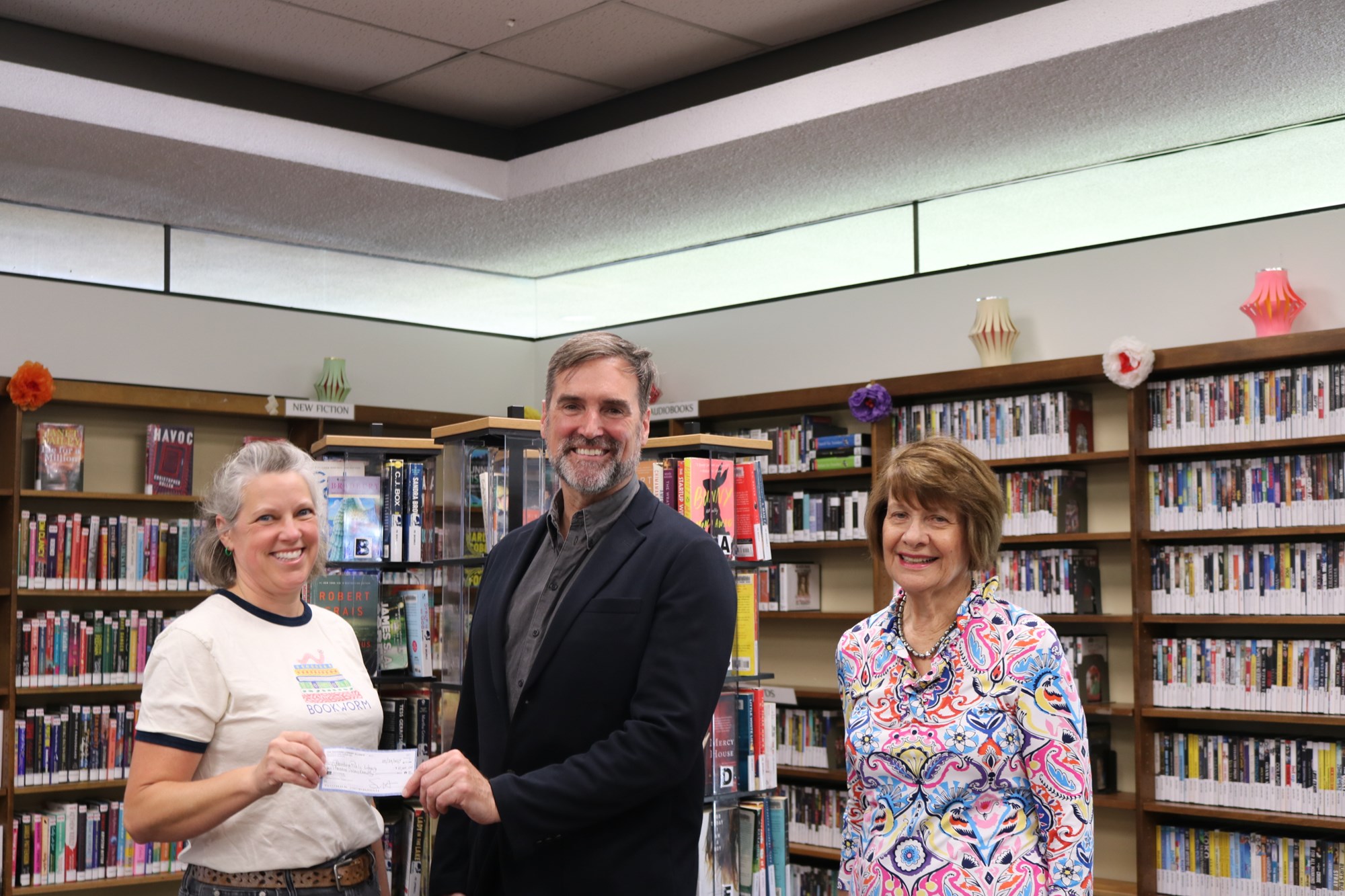 Emily Vitan, Tim McDonald and Christine Reeder together in a library Emily Vitan, Tim McDonald and Christine Reeder together in a library
