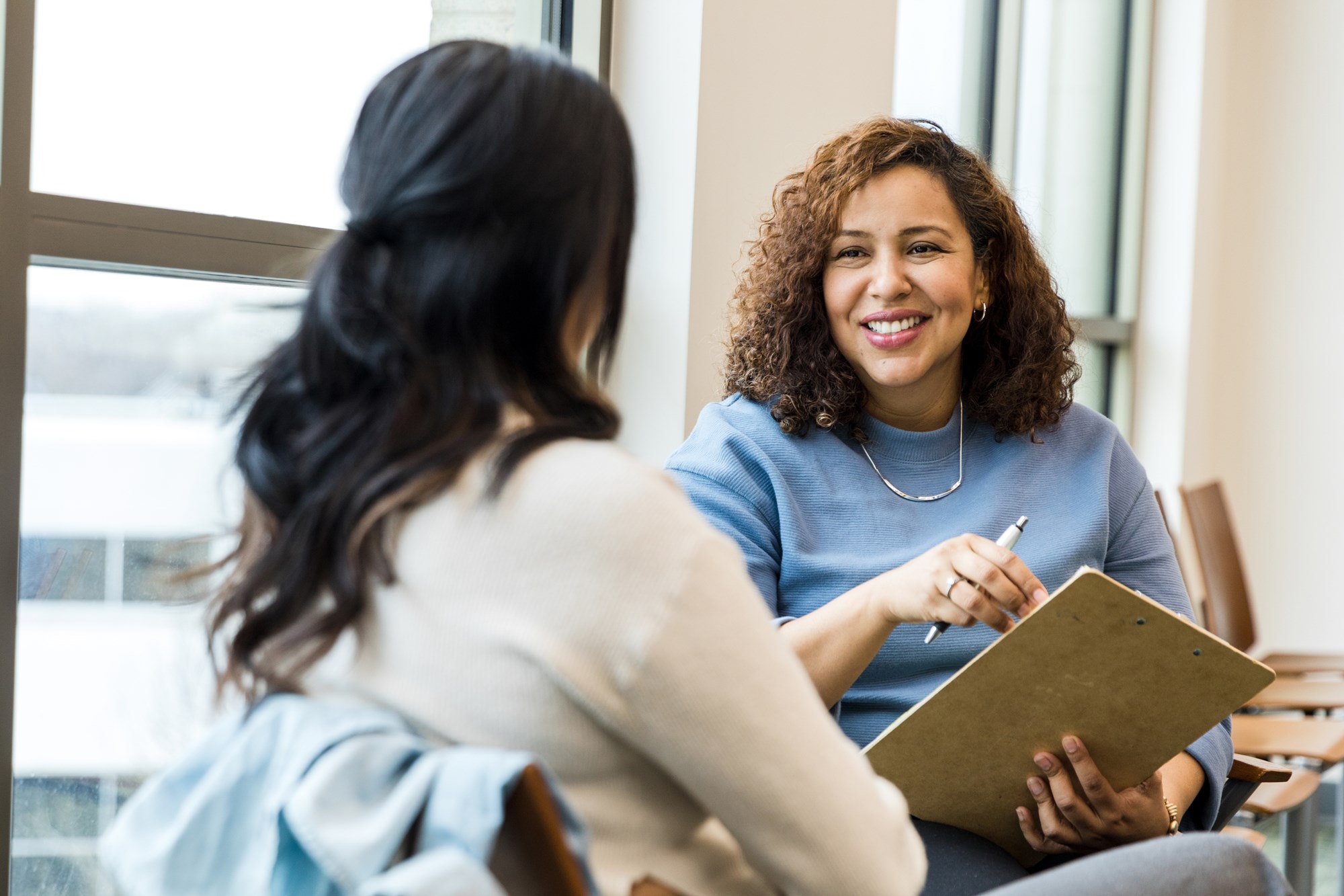woman counselor talking with client woman counselor talking with client