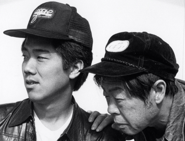 Image of two cool Chinese men in baseball caps from the movie Chan is Missing