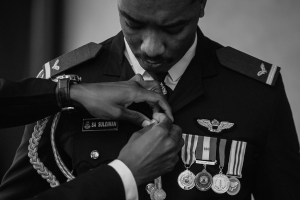 A military officer in uniform being awarded another medal.