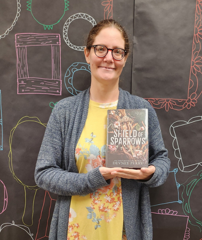 Staff holding The Buffalo Hunter by Stephen Graham Jones