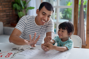 Father and daughter working on math.