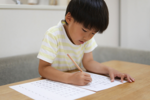 Child filling out a worksheet.