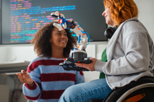 Two students showing classmates their science project.