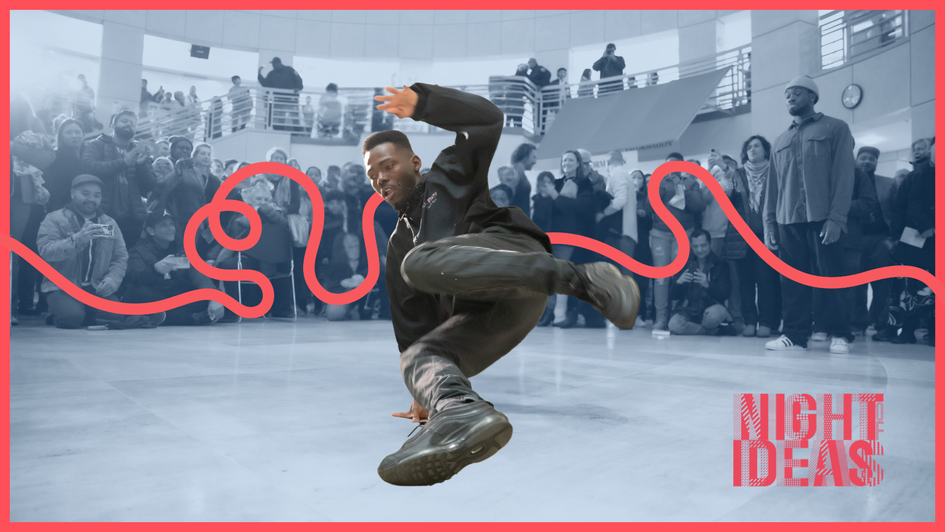 Guy break dancing in the middle of an excited crowd. This is the official banner for Night of Ideas.