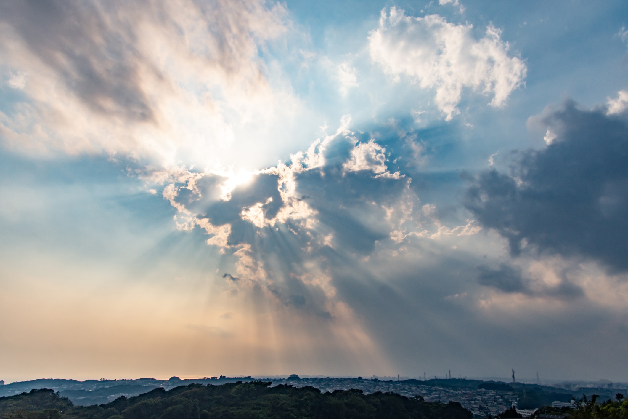 Blue Sky with Clouds and Sun Rays