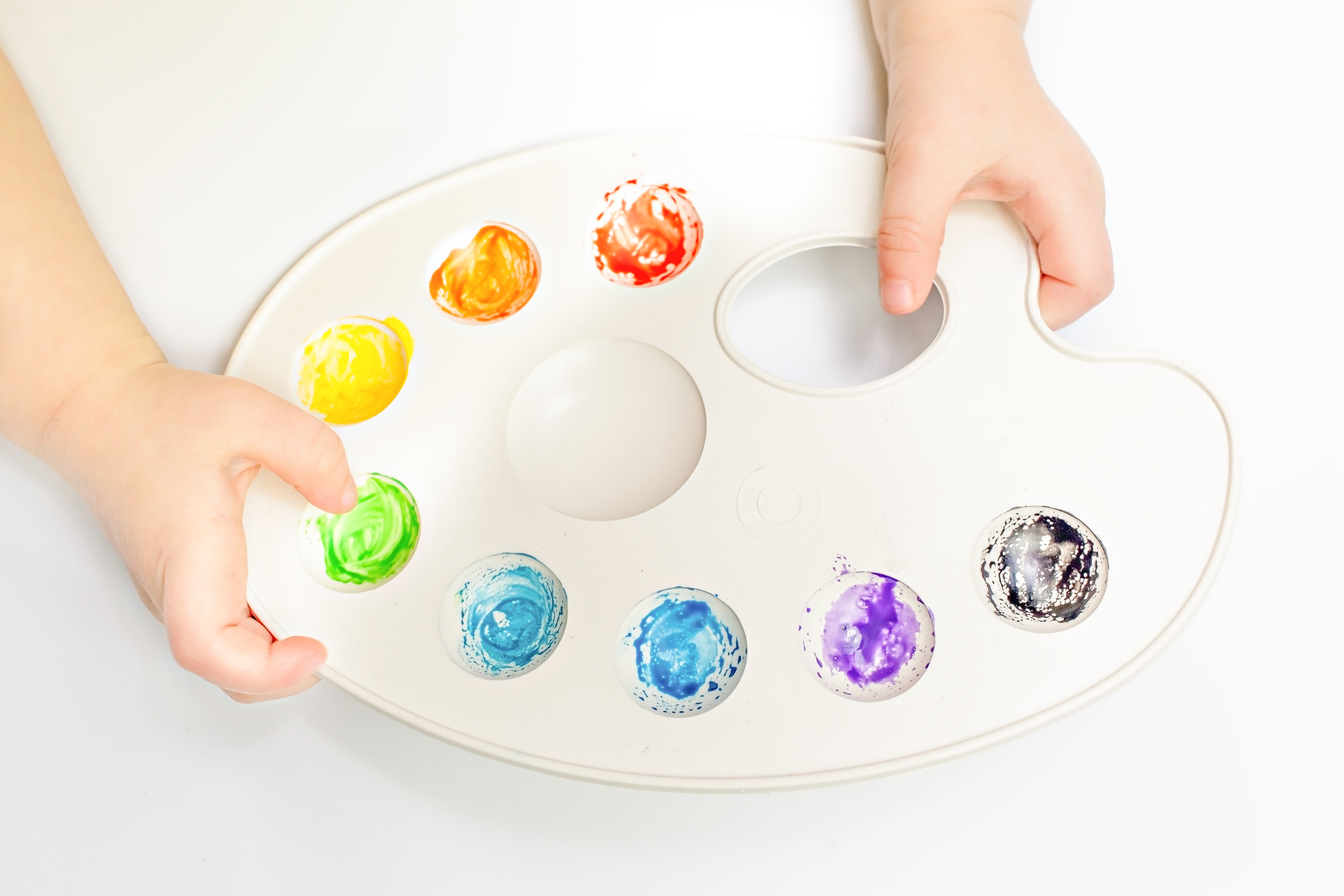 Child Hands Holding Paint Palette