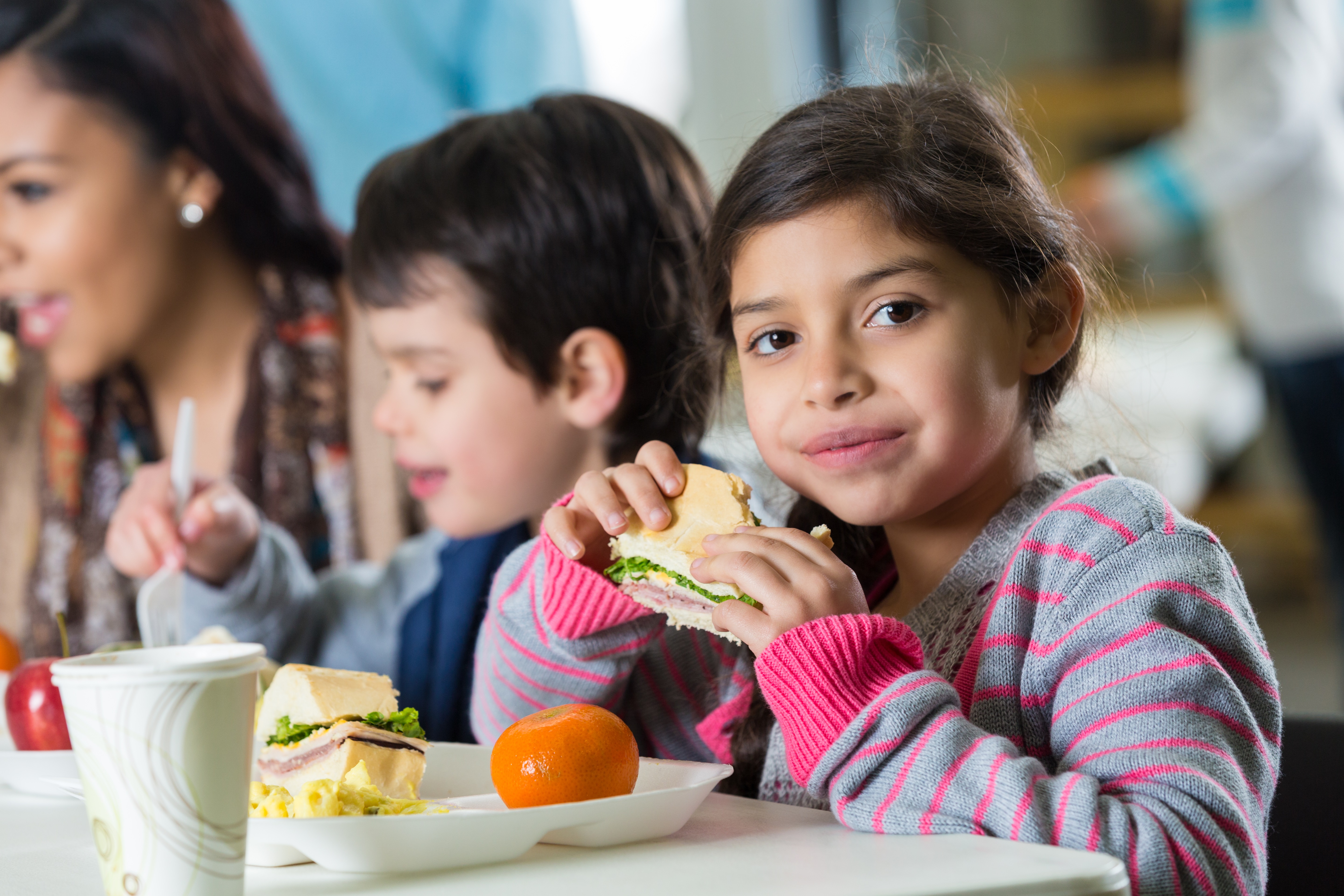 Group of Kids Eating in the School Cafeteria