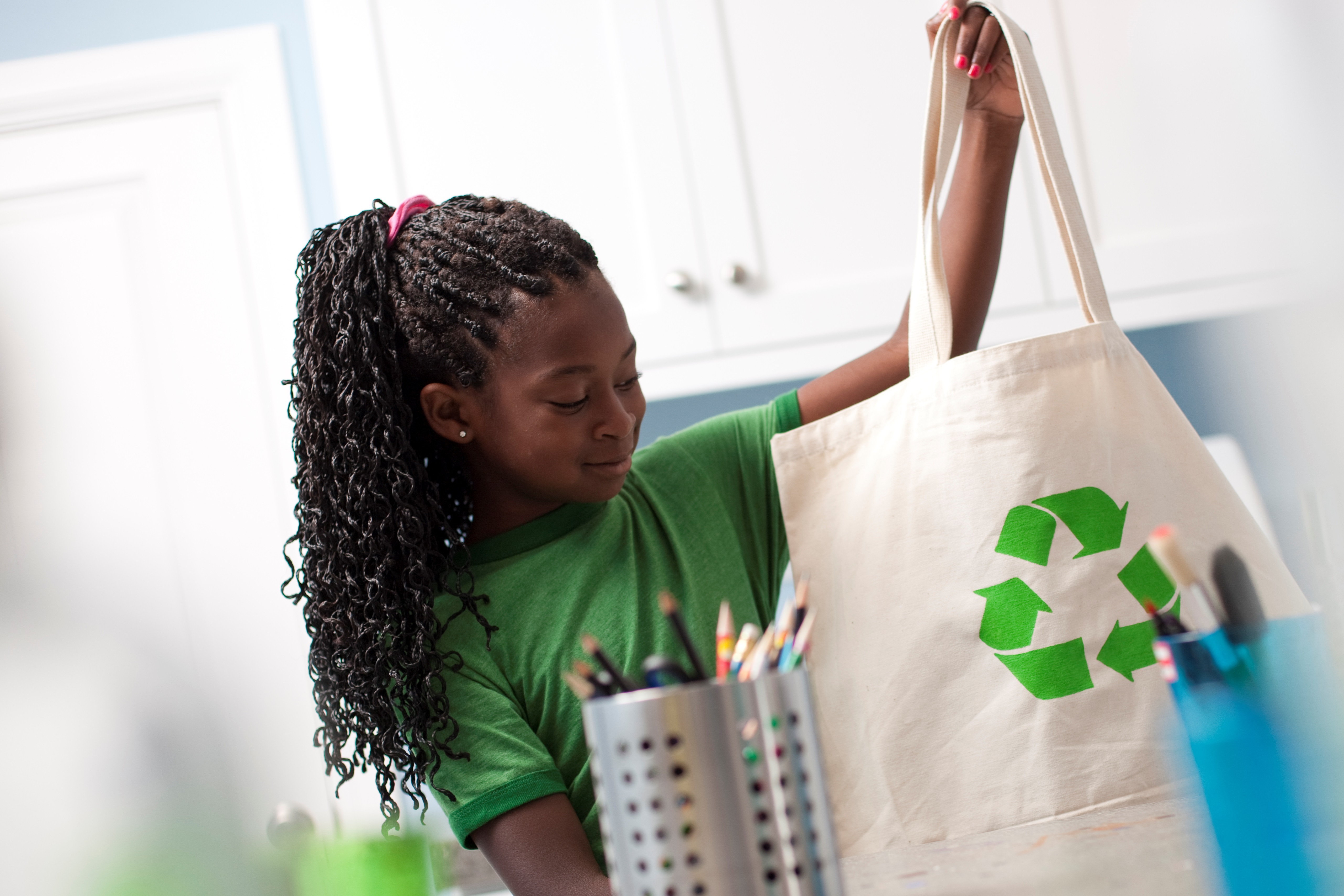 Young Girl Holding Reusable Shopping Bag