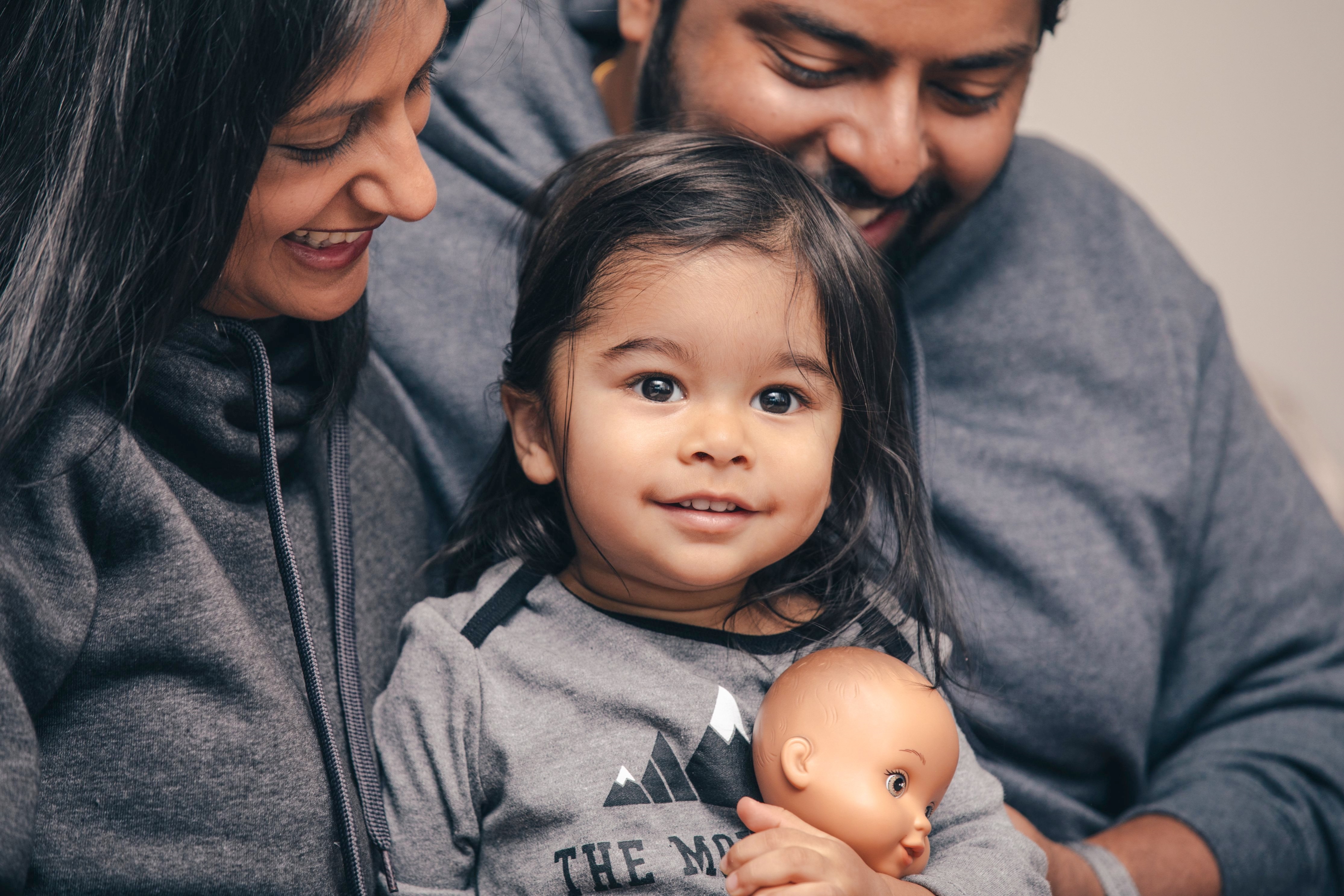 Parents and Child Sitting Together