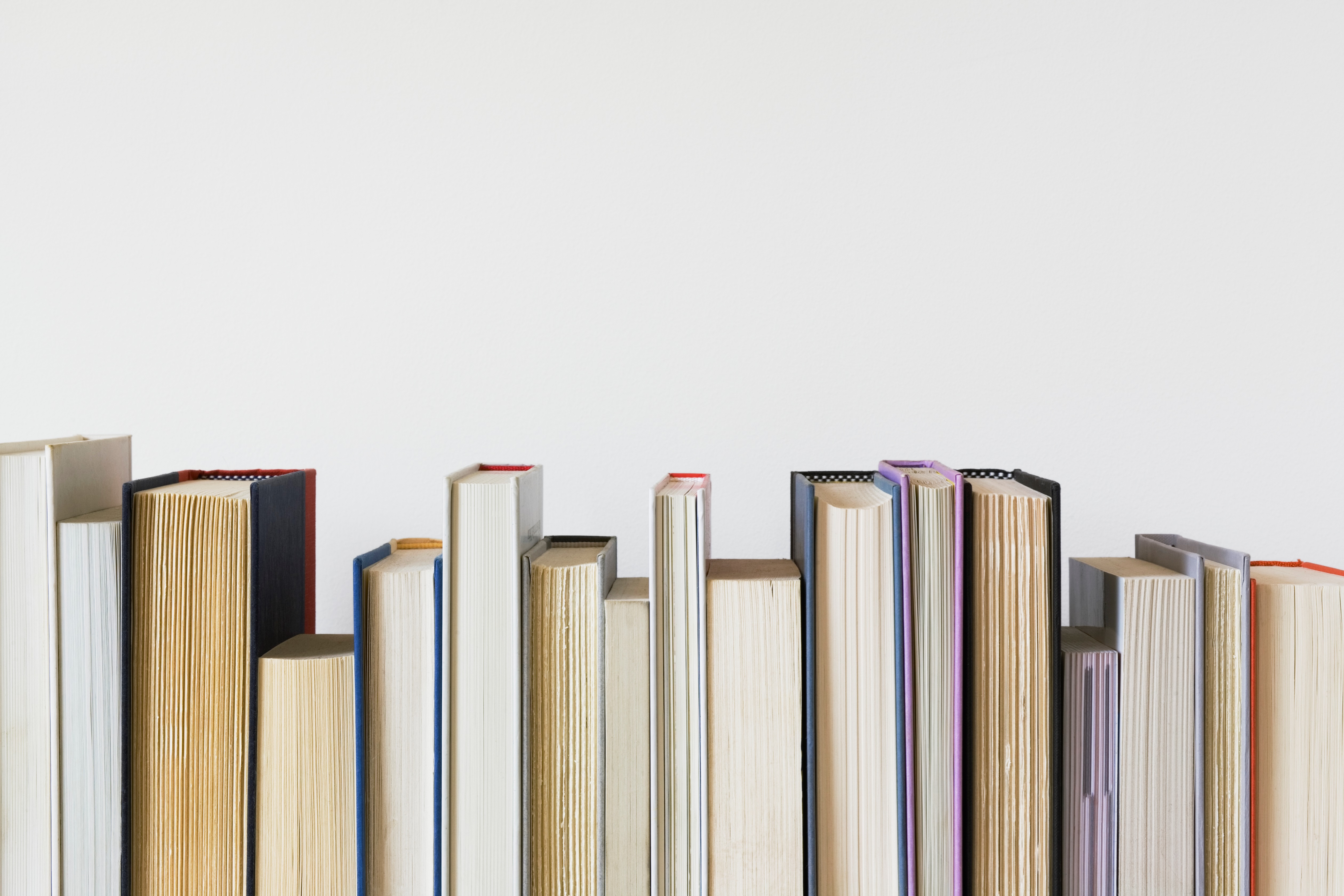 Row of Books Against a Blank Background