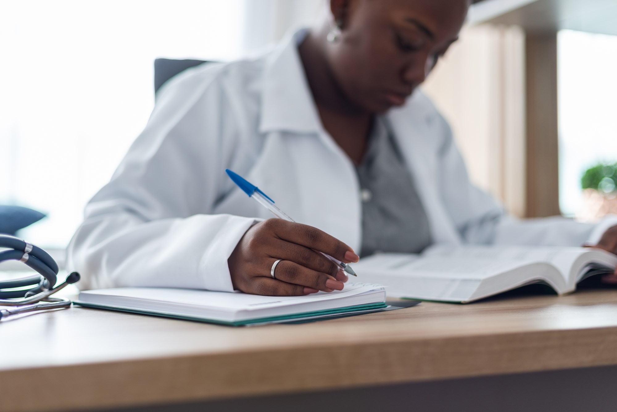 Portrait Of A Female Doctor Studying Alone In Her Office