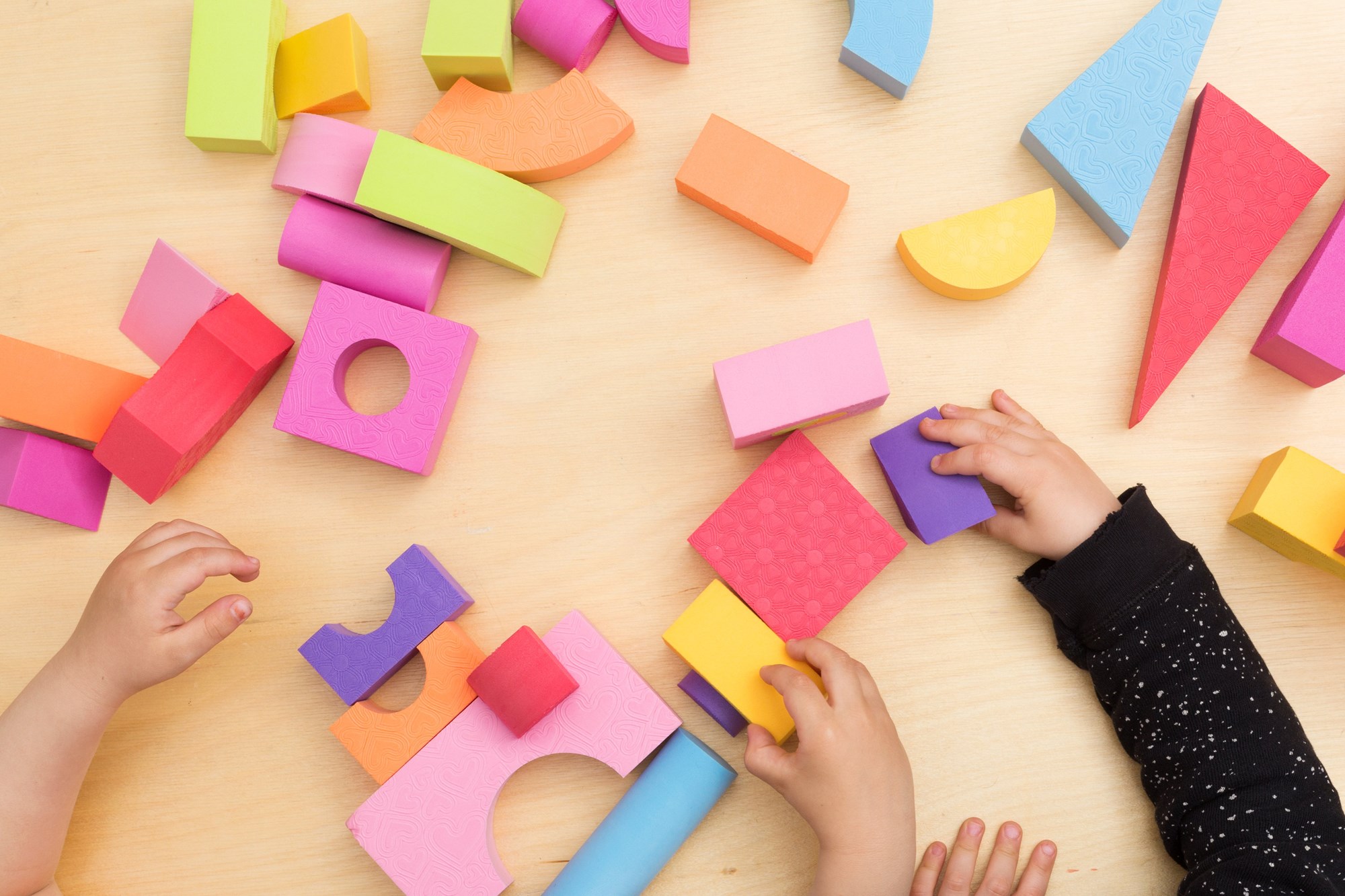 Toddlers playing with blocks
